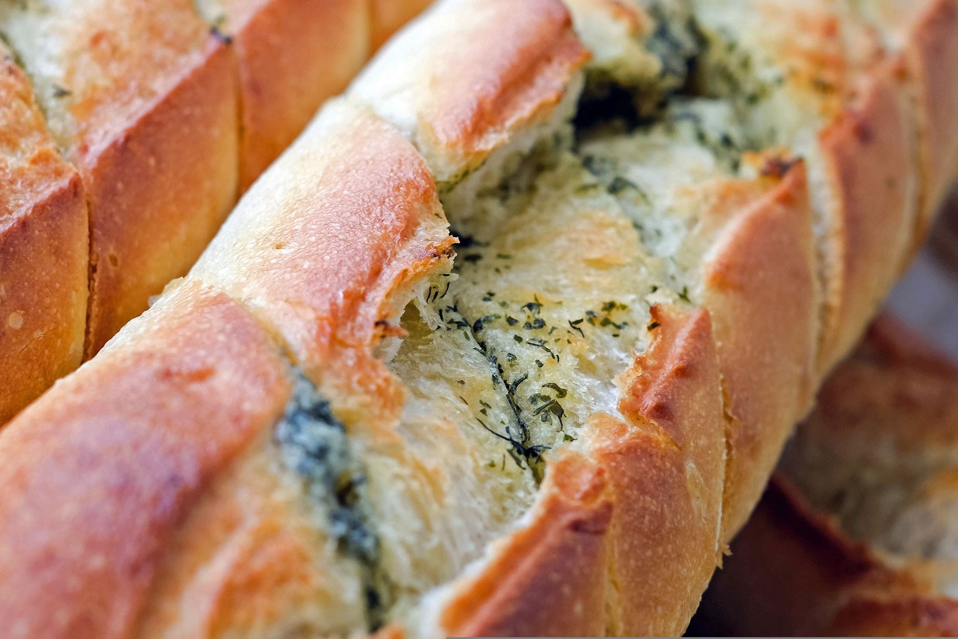 Deliciously textured garlic bread with herbs, perfect for a gourmet touch.