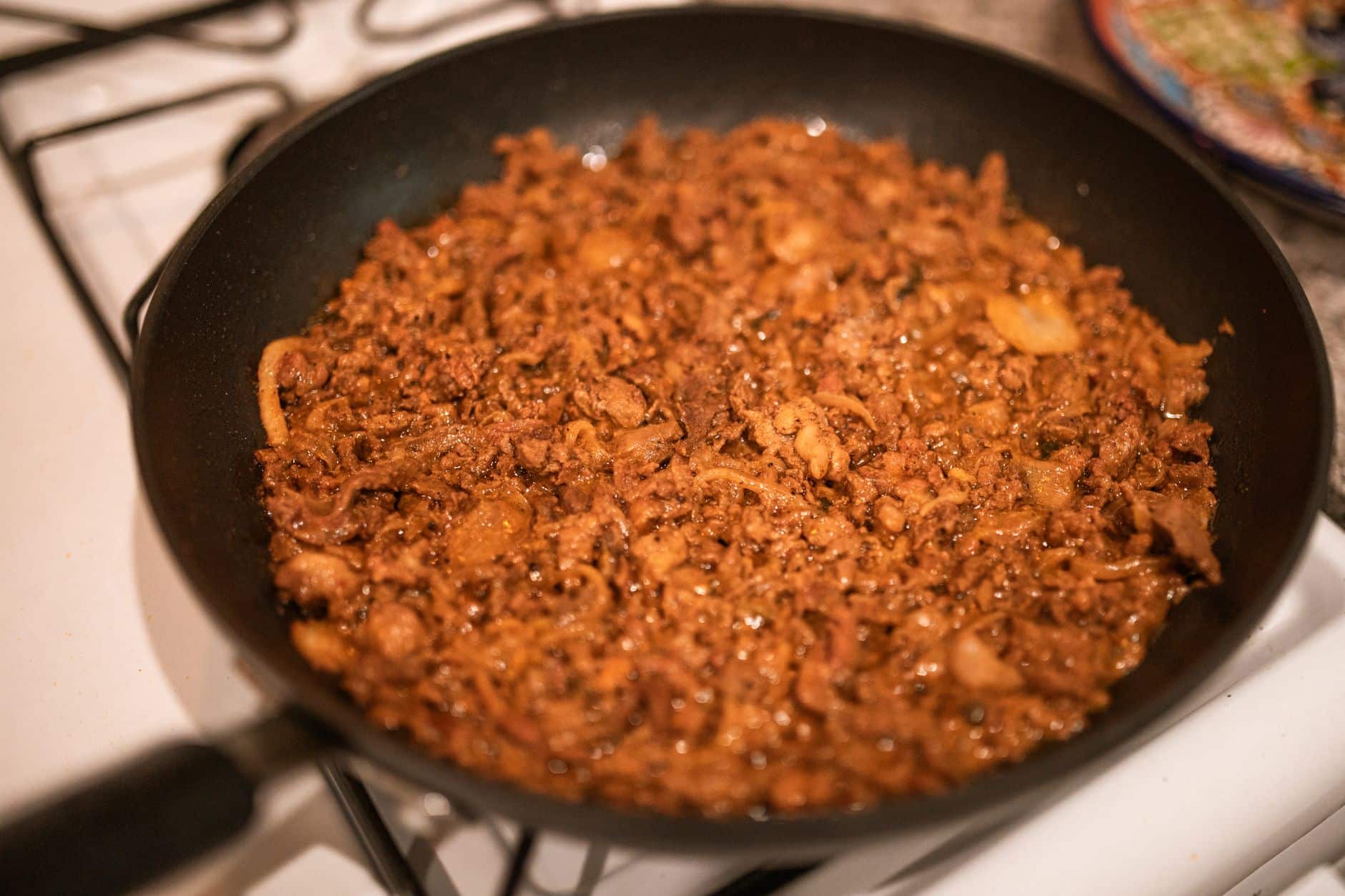 Delicious carne asada cooked in a pan, showcasing appetizing Mexican flavors.